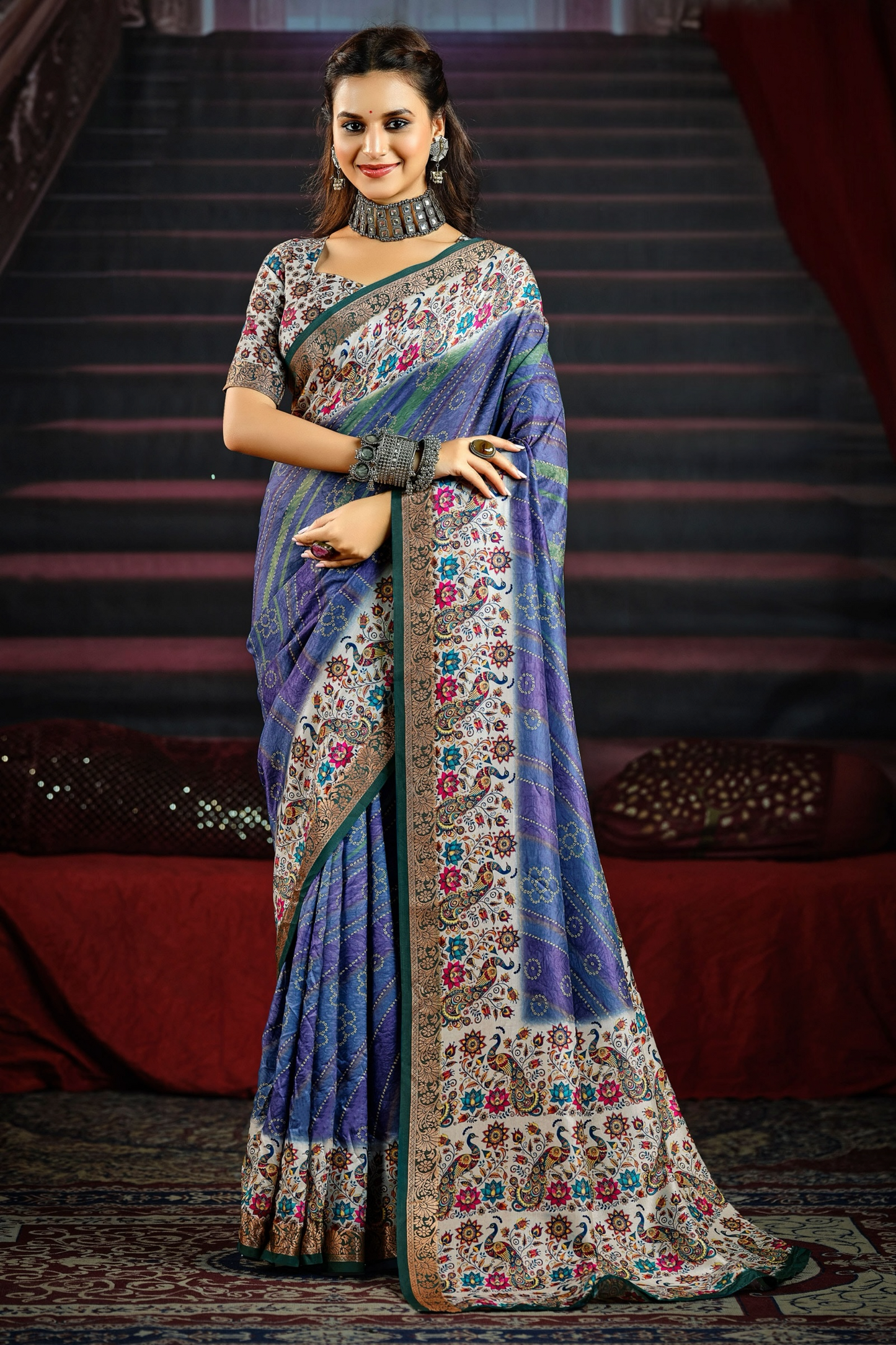 Elegant Blue Saree Adorned with Colorful Floral and Paisley Motifs, Featuring a Detailed Border and Pallu, Perfect for Festive and Special Occasions