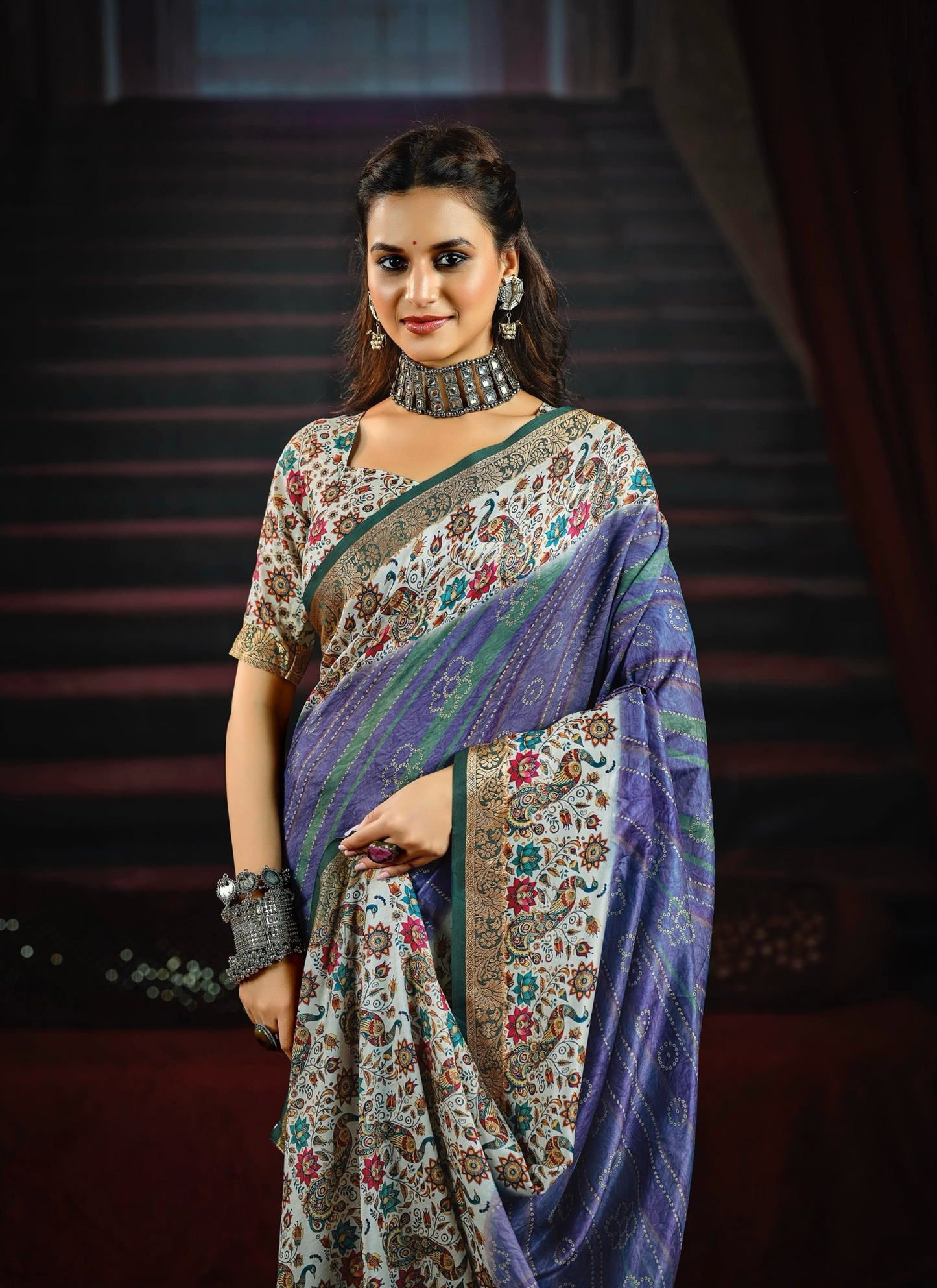 Elegant Blue Saree Adorned with Colorful Floral and Paisley Motifs, Featuring a Detailed Border and Pallu, Perfect for Festive and Special Occasions