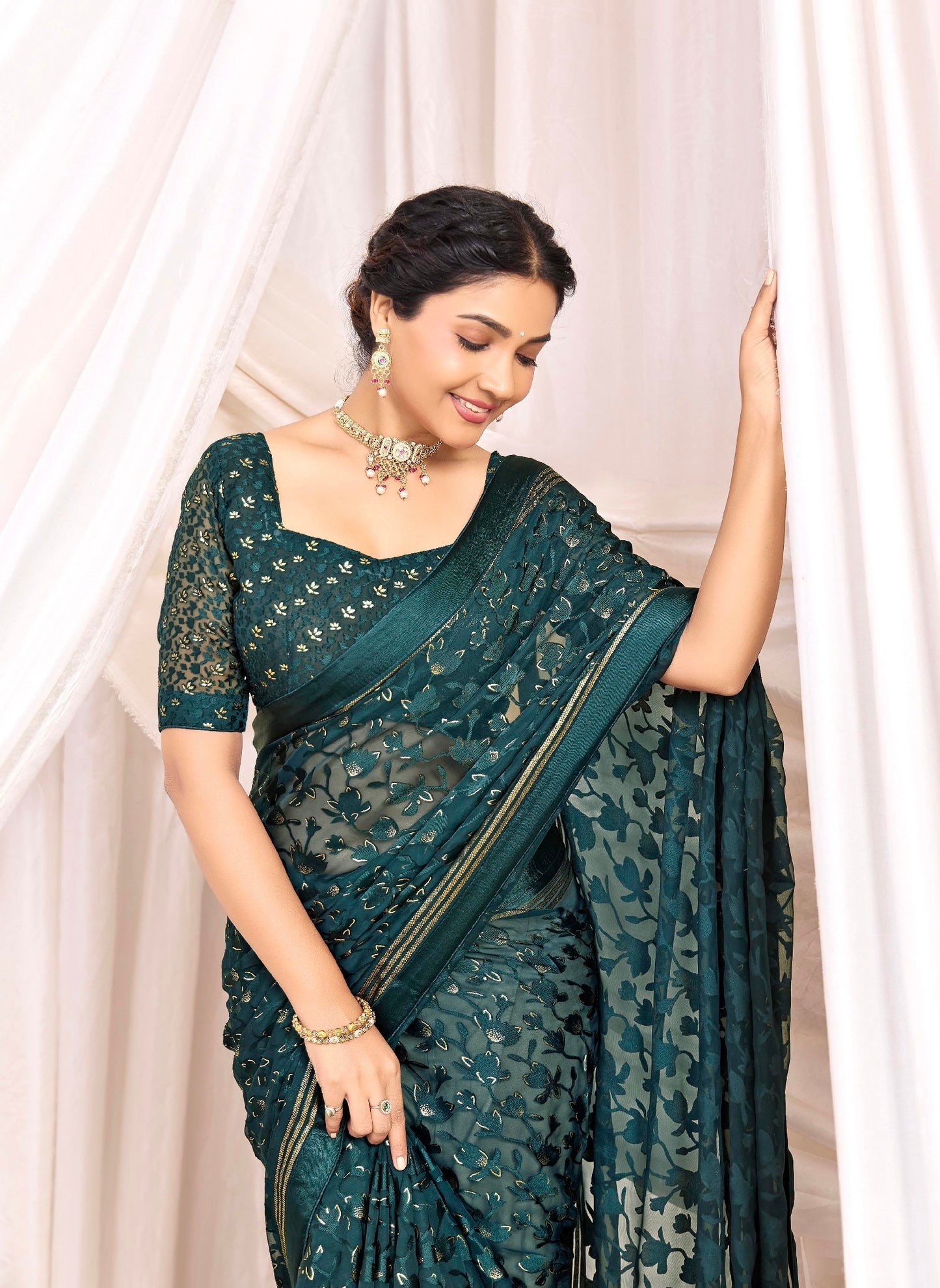 Pure Brasso fabric with Exclusive Bottle Green colored Designed with Featuring Interactive Gold & Silver Foil Touch with Rich Traditional Border Ideal for Day to Evening Events.