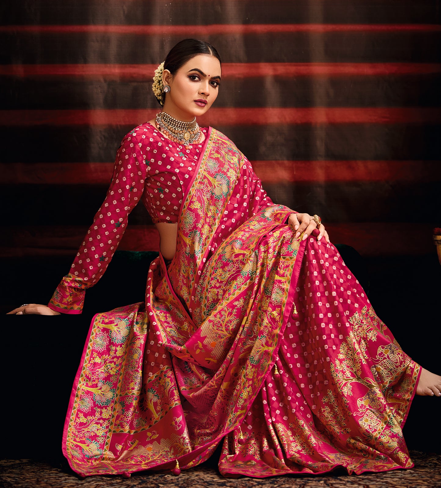 Rani Pink Wealvet Tusser Silk fabric with Attractive Kalamkari Hand Painted and Foil Touch with Exclusive Bandhej Print & Grounded Tussels.