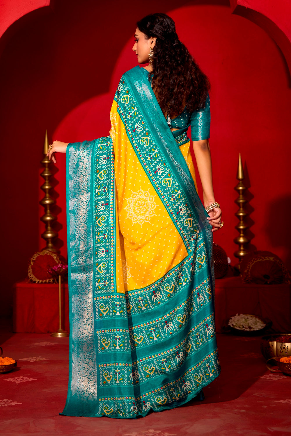 Pure Silk fabric with Lemon Yellow and Turquoise Blue Dual color Combination of Exclusive Bandhej print with Rich Look Jacquard Border Exclusive Look Saree