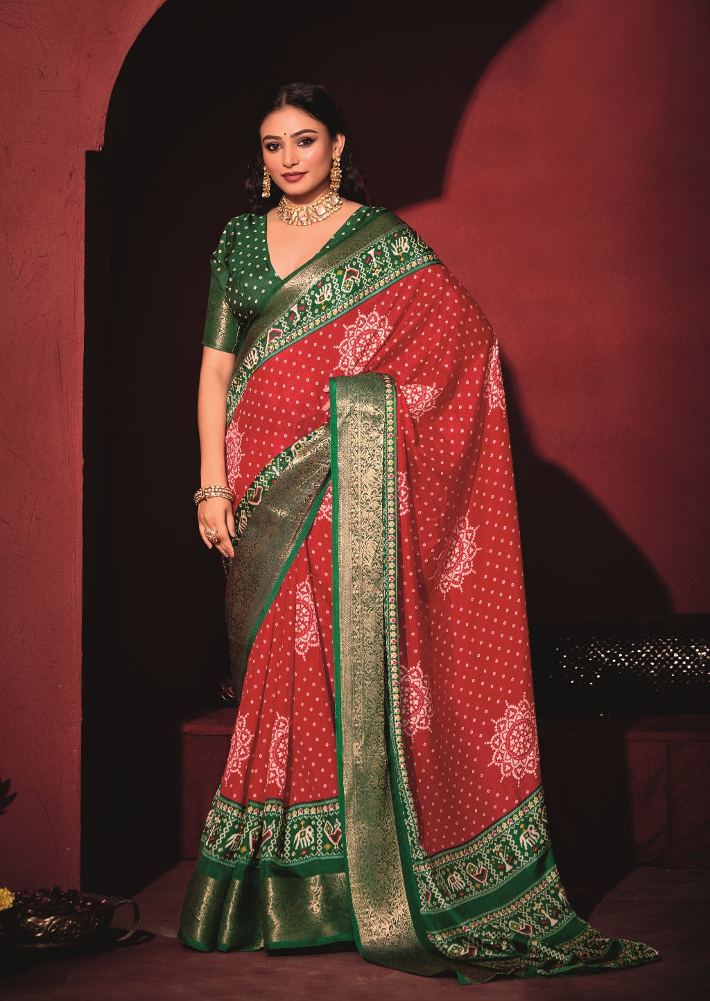Pure Silk fabric with Exclusive Red and Dark Green Dual color Combination of Exclusive Bandhej print with Rich Look Jacquard Border Exclusive Look Saree
