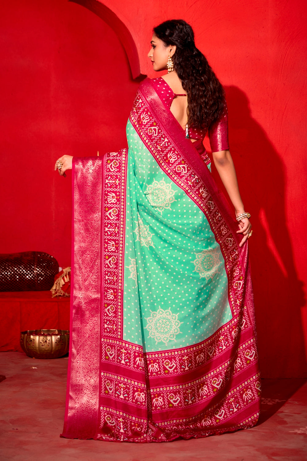 Pure Silk fabric with Exclusive Light Sea Green and Magenta Dual color Combination of Exclusive Bandhej print with Rich Look Jacquard Border Exclusive Look Saree