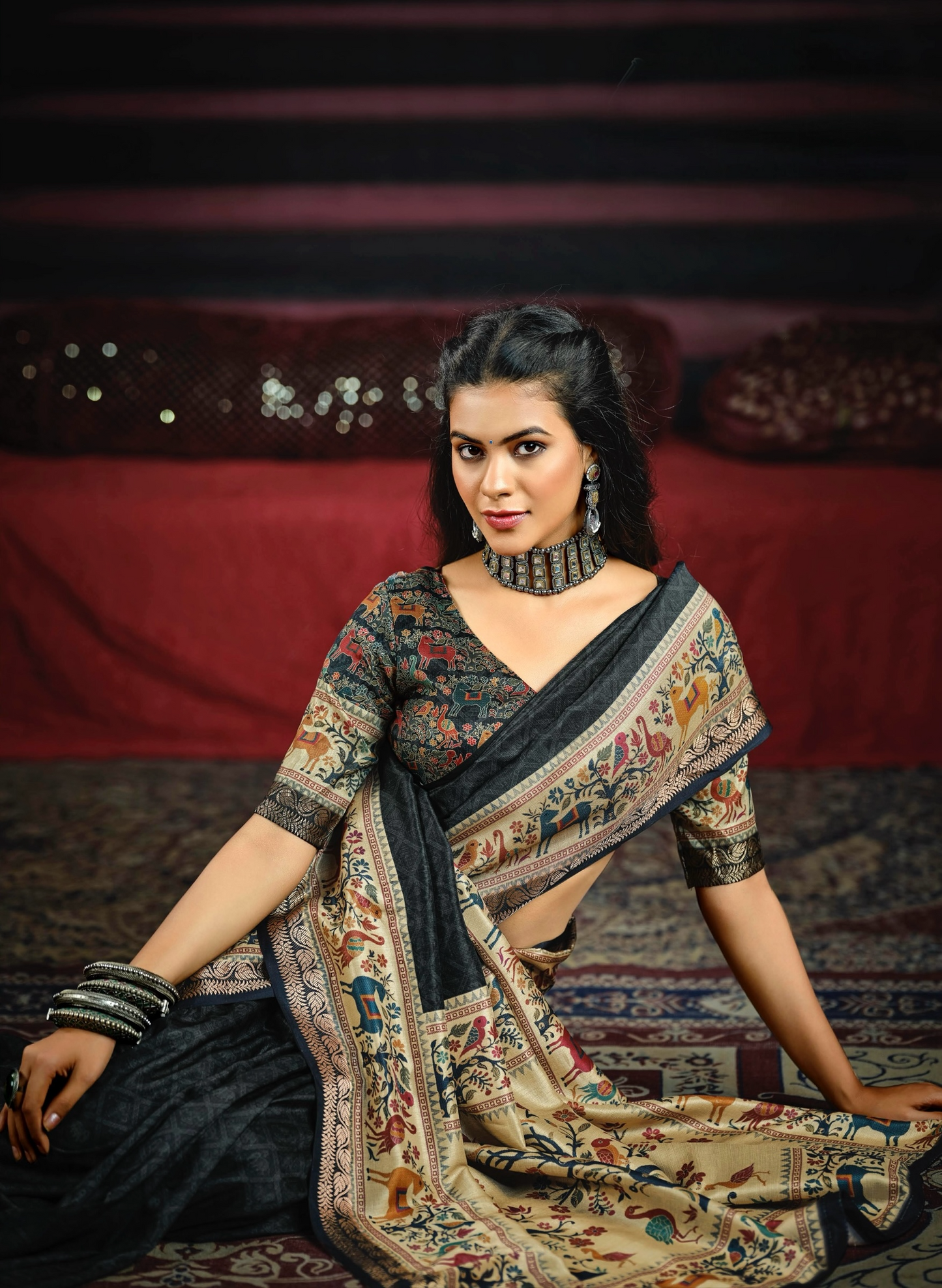 Elegant Black Saree with Artistic Animal and Tree Motifs, Featuring a Beautifully Detailed Border and Pallu, Perfect for Festive and Ethnic Occasions.