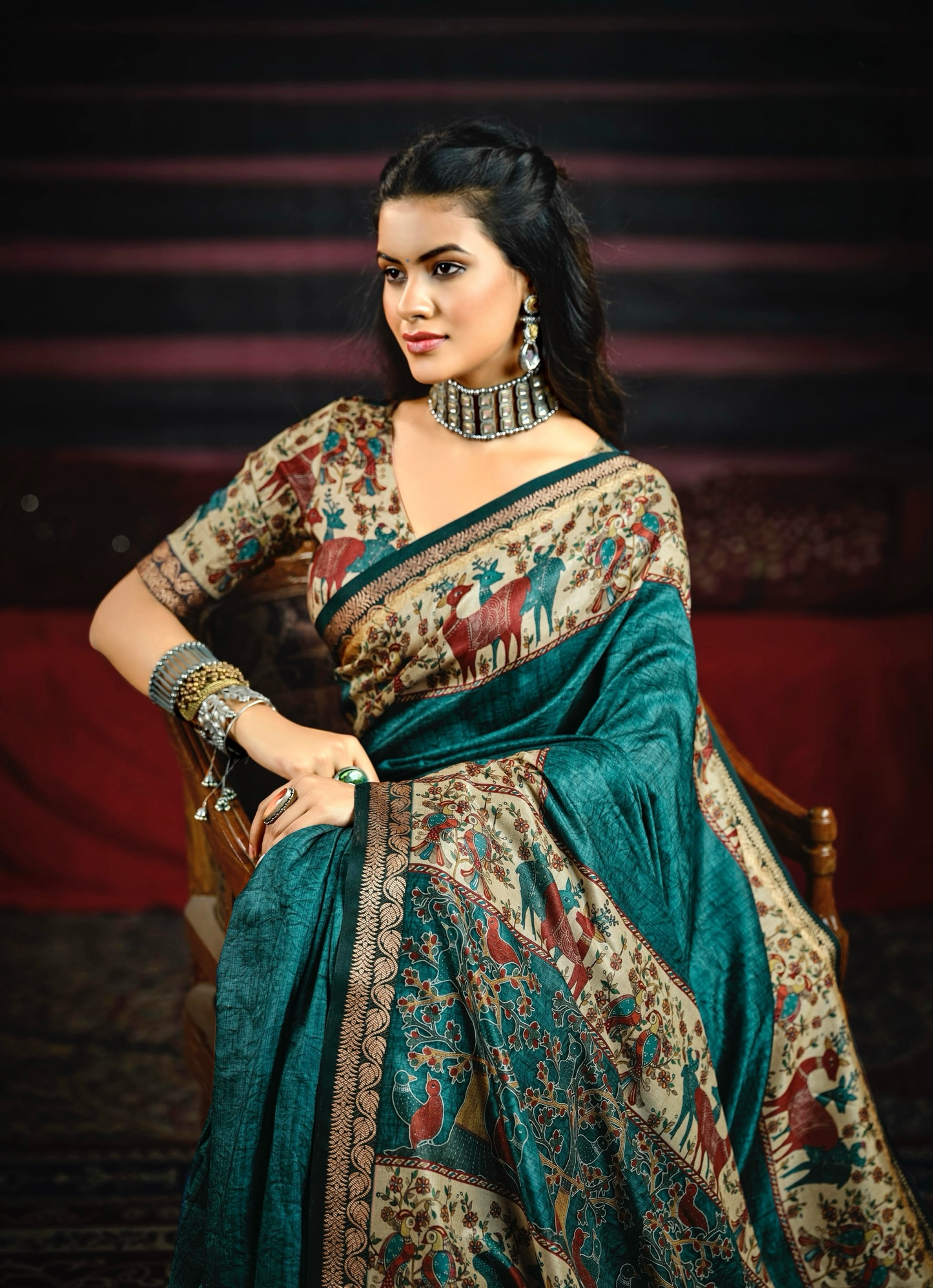Vibrant Teal-Blue Saree Featuring Traditional Animal and Floral Motifs with a Richly Detailed Pallu and Border, Perfect for Festive and Elegant Occasions