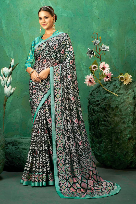 Exclusive Brasso fabric with Attractive signature burnout motifs and a contrast border for festive elegance and effortless drape.