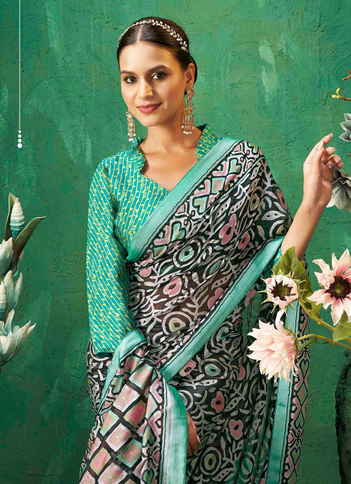 Exclusive Brasso fabric with Attractive signature burnout motifs and a contrast border for festive elegance and effortless drape.