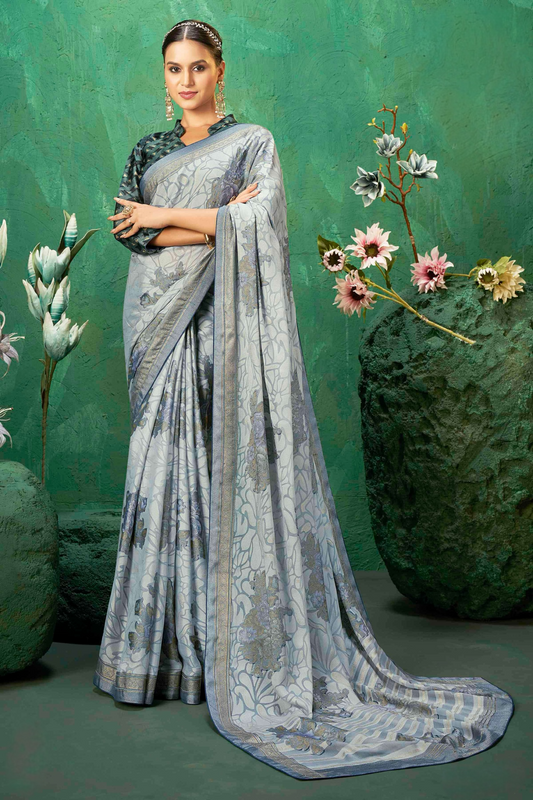 Exclusive Brasso fabric with featuring Delicate Floral Patterns and a Subtle Shimmer with Designer border for Festive Elegance and Effortless Drape.