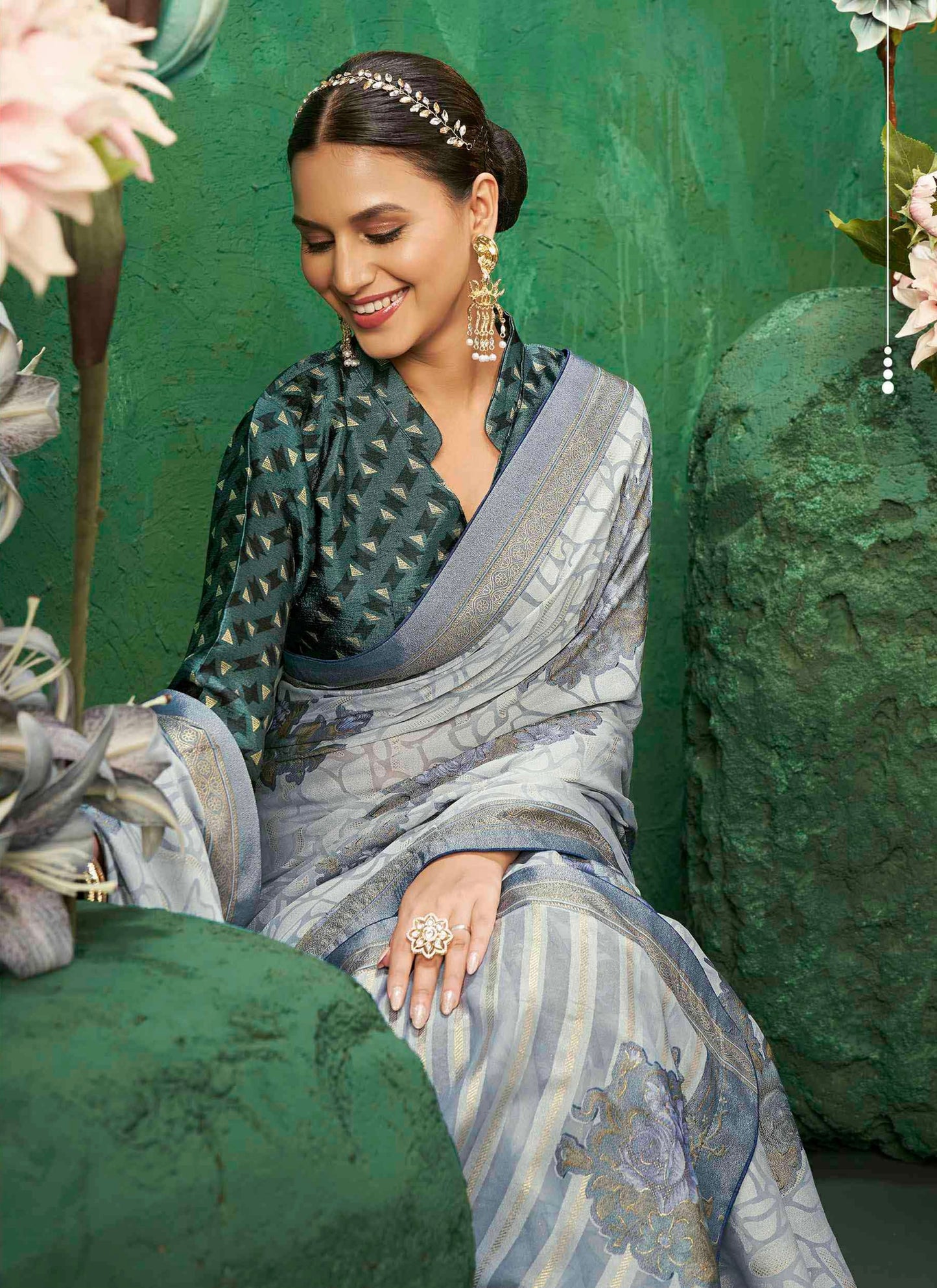 Exclusive Brasso fabric with featuring Delicate Floral Patterns and a Subtle Shimmer with Designer border for Festive Elegance and Effortless Drape.