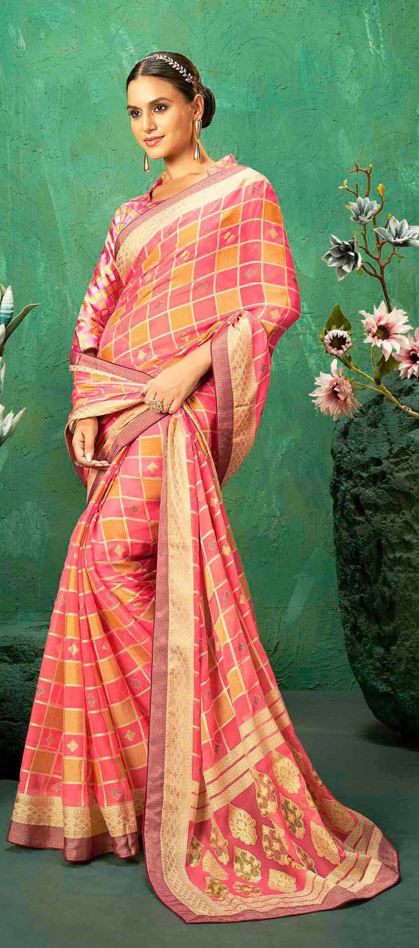 Exclusive Brasso fabric with Striking pink and golden checkered pattern with contrast border for luxurious finishing touches .