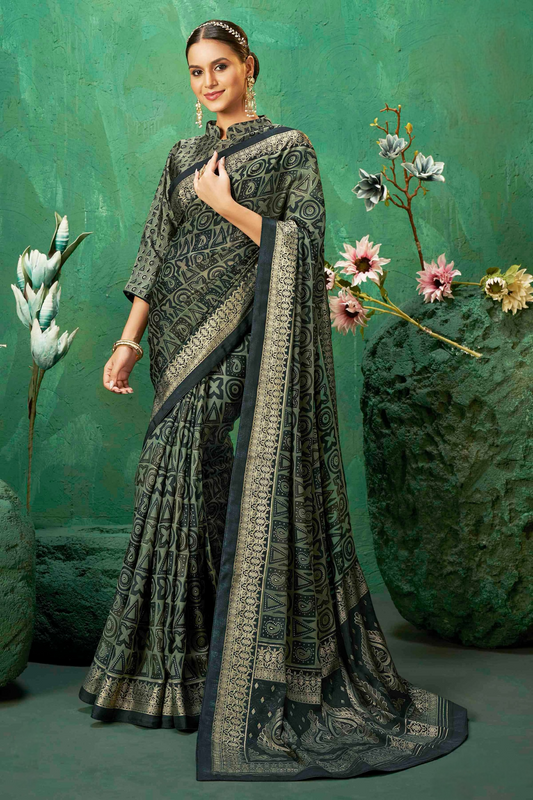 Exclusive Brasso fabric with Striking Black color adorned with Intricate Geometric Patterns and a Grand Gold-toned Border for Festive Occasions and Sophisticated Evenings.
