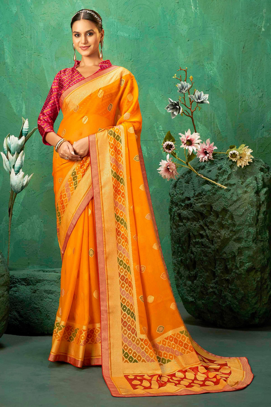 Exclusive Brasso fabric with Vibrant Orange color Designed with Delicate Self Motifs and a Luxurious Contrasting Border Perfect for Festive Events, Weddings, and Bright Celebrations.