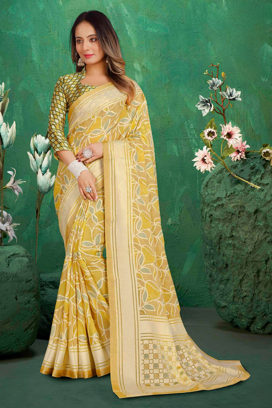 Exclusive Brasso fabric with Pale Yellow-colored Designed with Featuring Elegant Leaf and Floral Print and an Intricate Floral Border Ideal for Elegant Daytime Events.