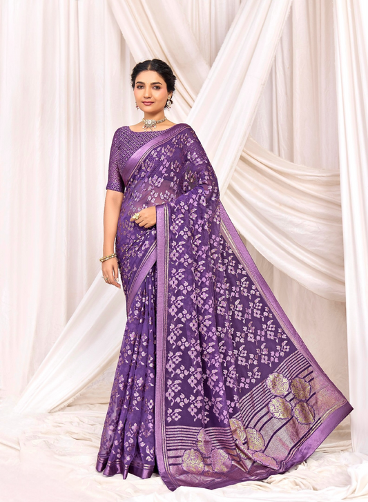 Pure Brasso fabric with Exclusive Purple colored Designed with Featuring Gold Foil Touch with Rich Traditional Border Ideal for Day to Evening Events.