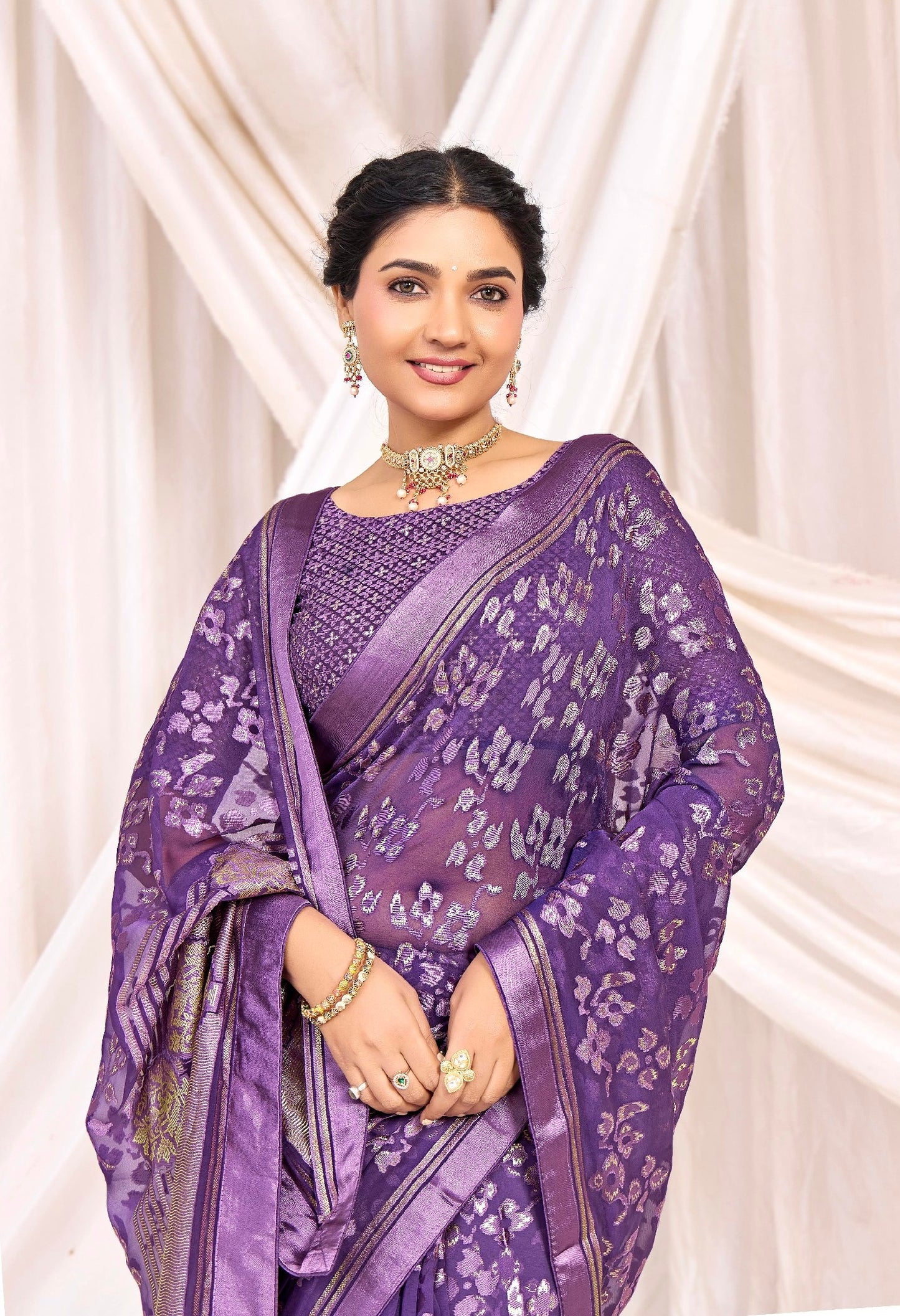 Pure Brasso fabric with Exclusive Purple colored Designed with Featuring Gold Foil Touch with Rich Traditional Border Ideal for Day to Evening Events.