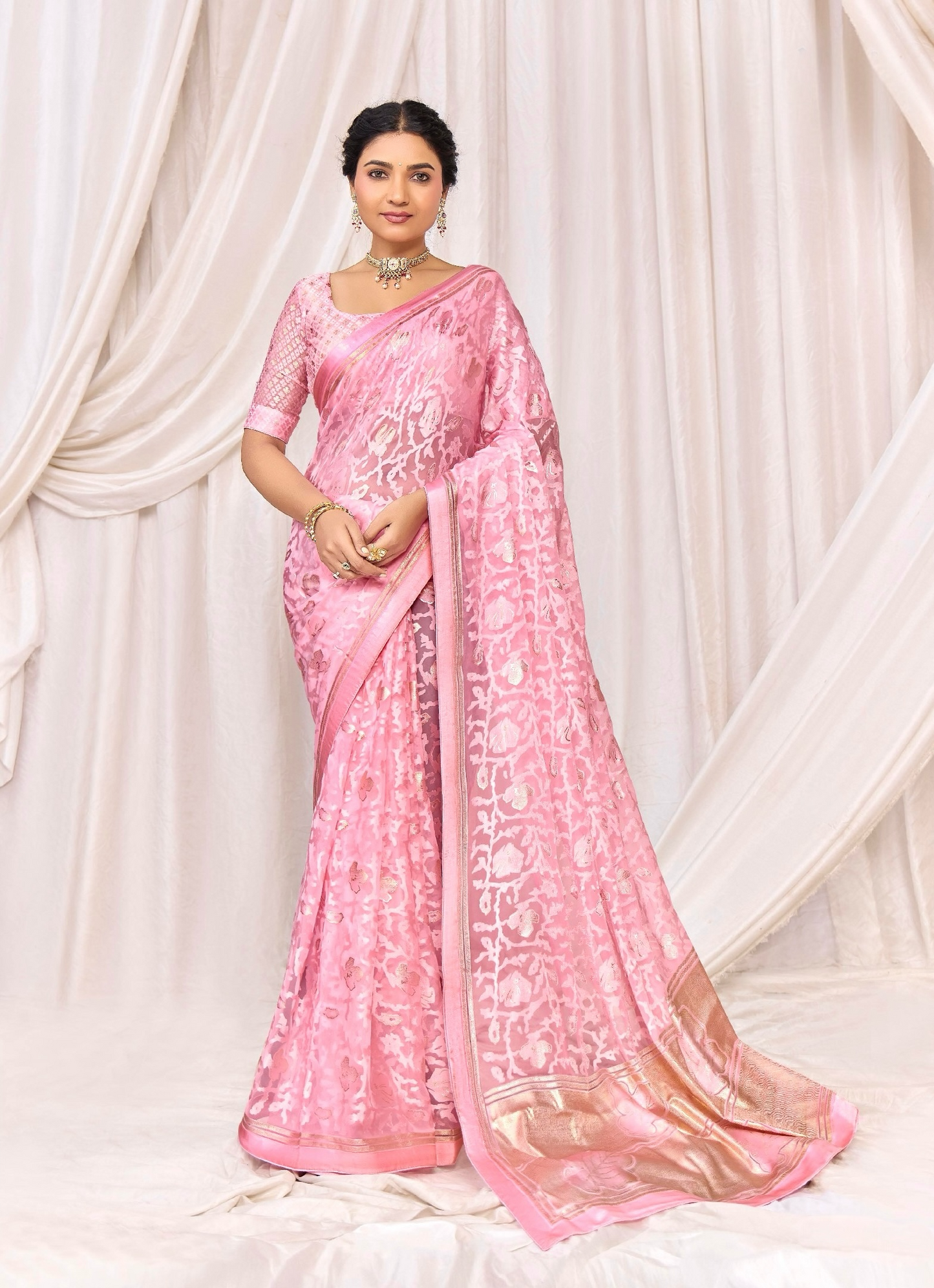 Pure Brasso fabric with Exclusive Baby Pink colored Designed with Featuring Interactive Gold & Silver Foil Touch with Rich Traditional Border Ideal for Day to Evening Events.