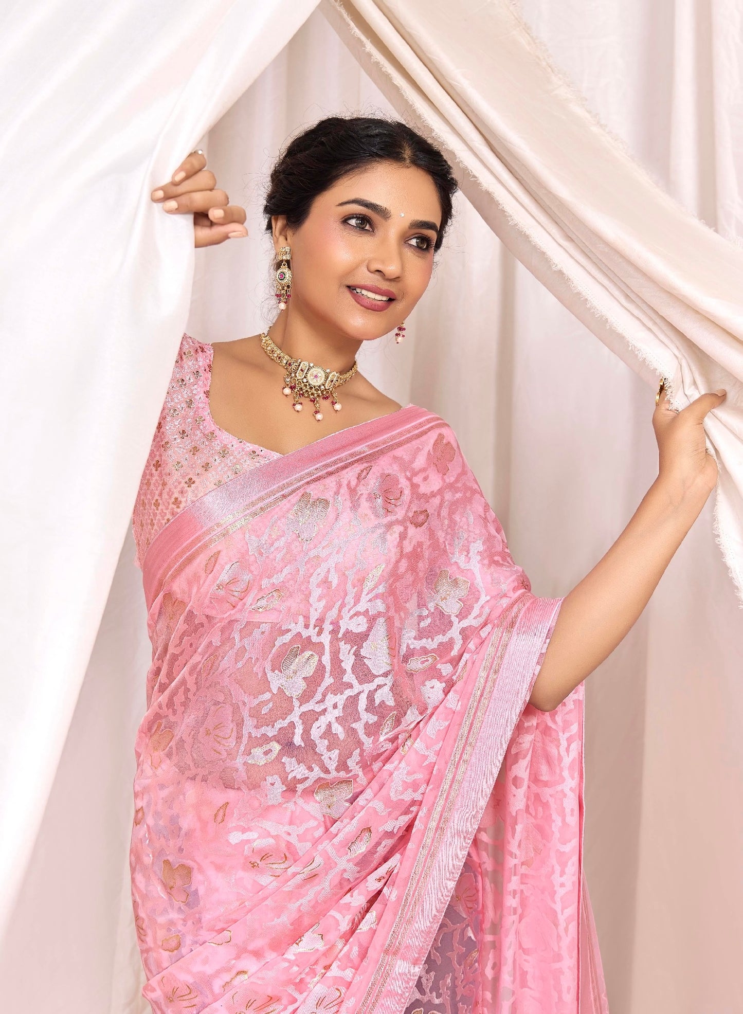 Pure Brasso fabric with Exclusive Baby Pink colored Designed with Featuring Interactive Gold & Silver Foil Touch with Rich Traditional Border Ideal for Day to Evening Events.