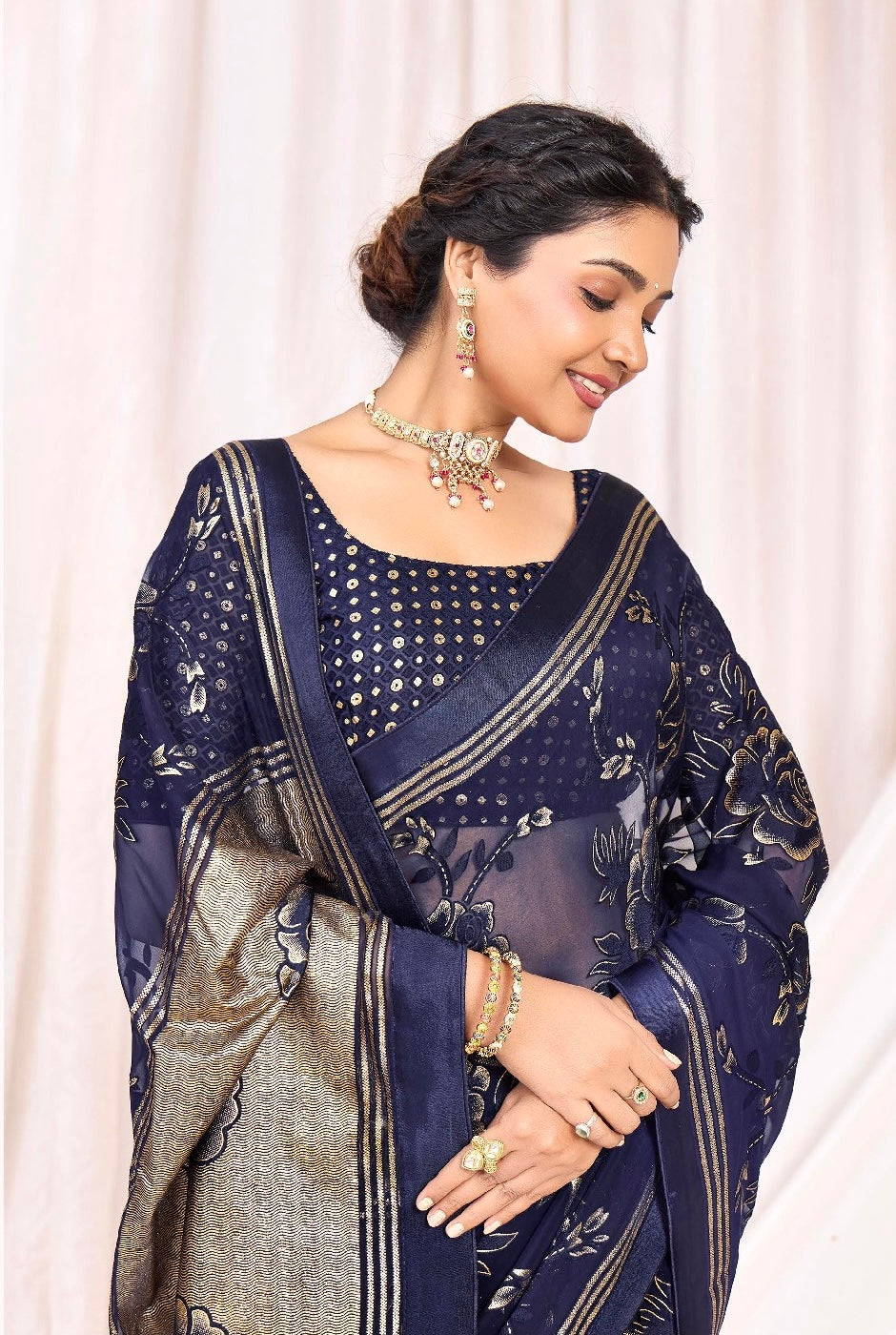 Pure Brasso fabric with Exclusive Deep Navy Blue colored Designed with Featuring Interactive Gold & Silver Foil Touch with Rich Traditional Border Ideal for Day to Evening Events.