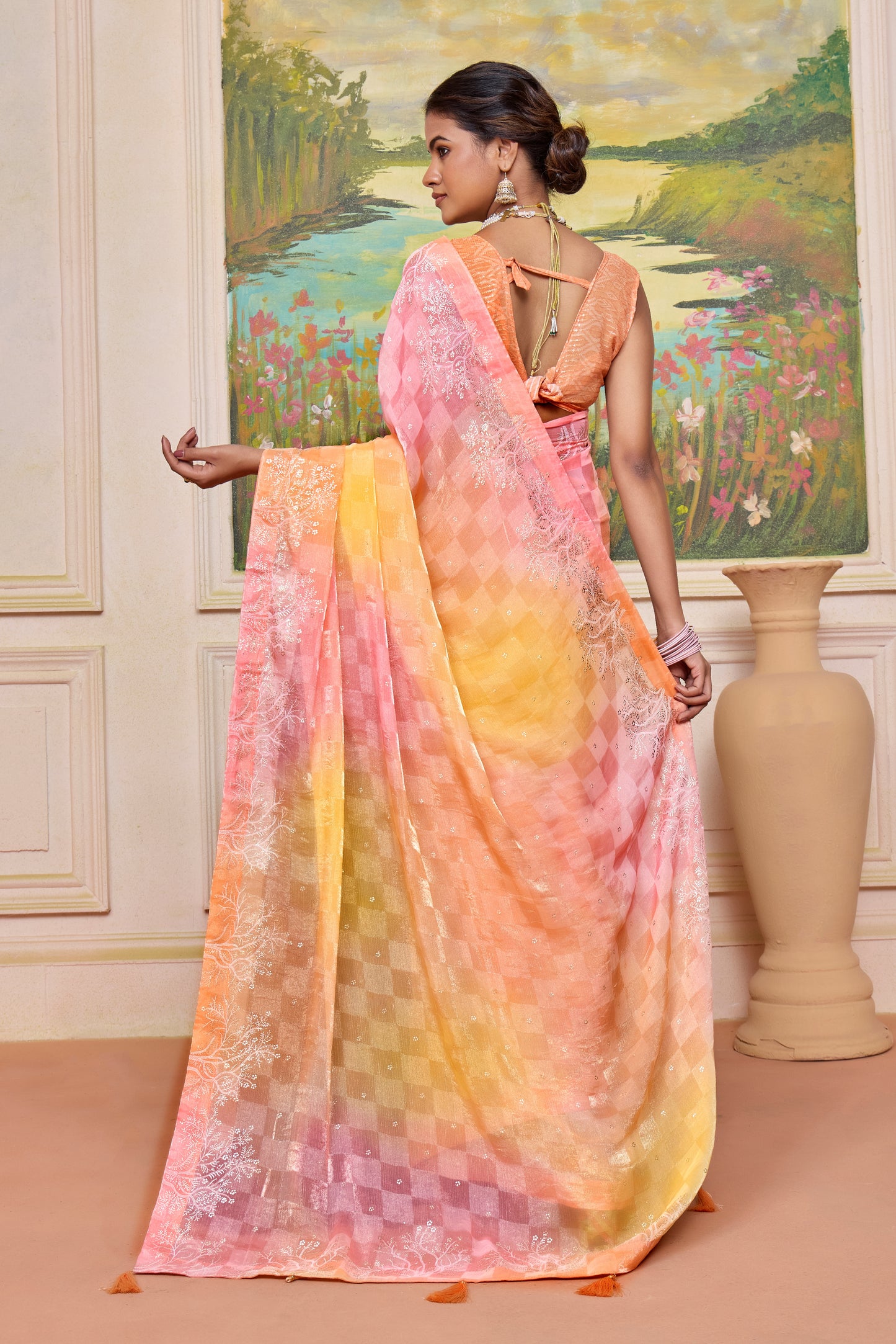 Elegant Pastel Orange and Pink Brasso Saree with a Checkered Design and Delicate Embroidery with Heavy Sequence Blouse Perfect for Festive and Special Occasions