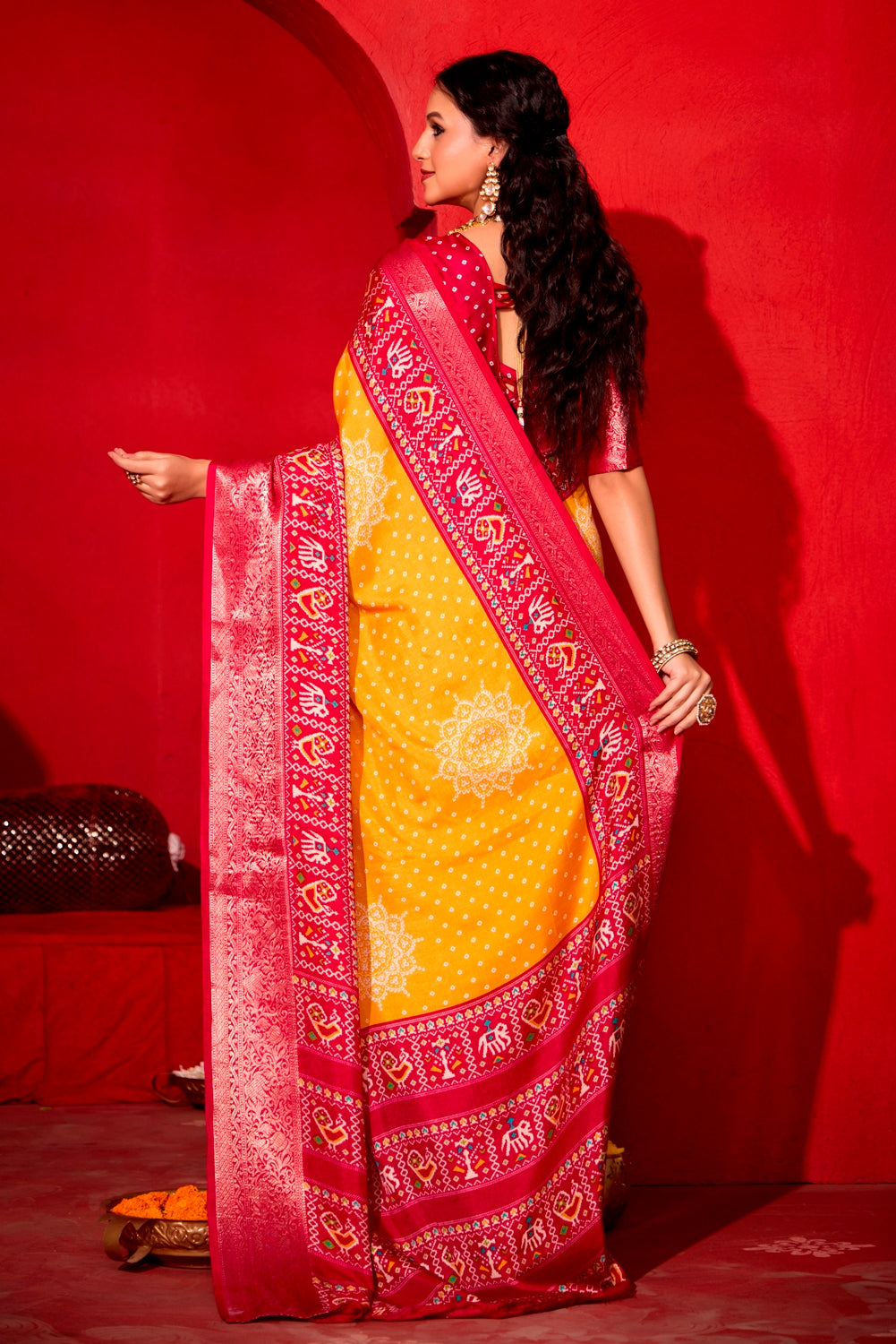 Pure Silk fabric with Turmeric Yellow and Red Dual color Combination of Exclusive Bandhej print with Rich Look Jacquard Border Exclusive Look Saree