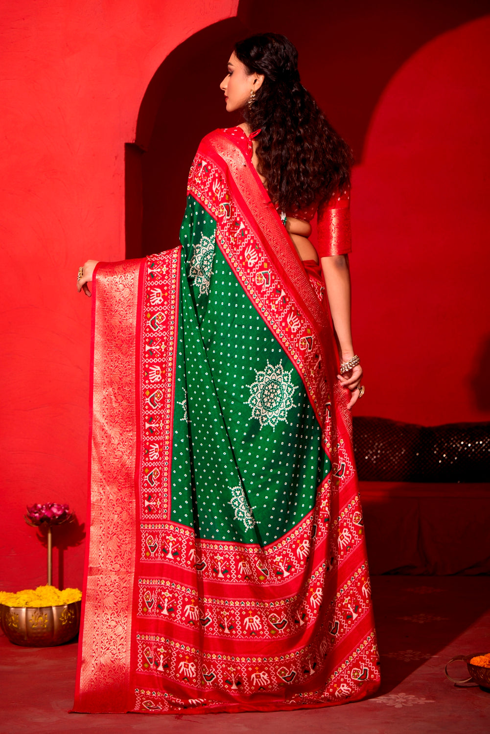 Pure Silk fabric with Dark Green and Red Dual color Combination of Exclusive Bandhej print with Rich Look Jacquard Border Exclusive Look Saree