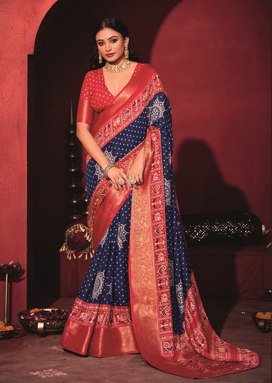 Pure Silk fabric with Royal Blue and Red Dual color Combination of Exclusive Bandhej print with Rich Look Jacquard Border Exclusive Look Saree