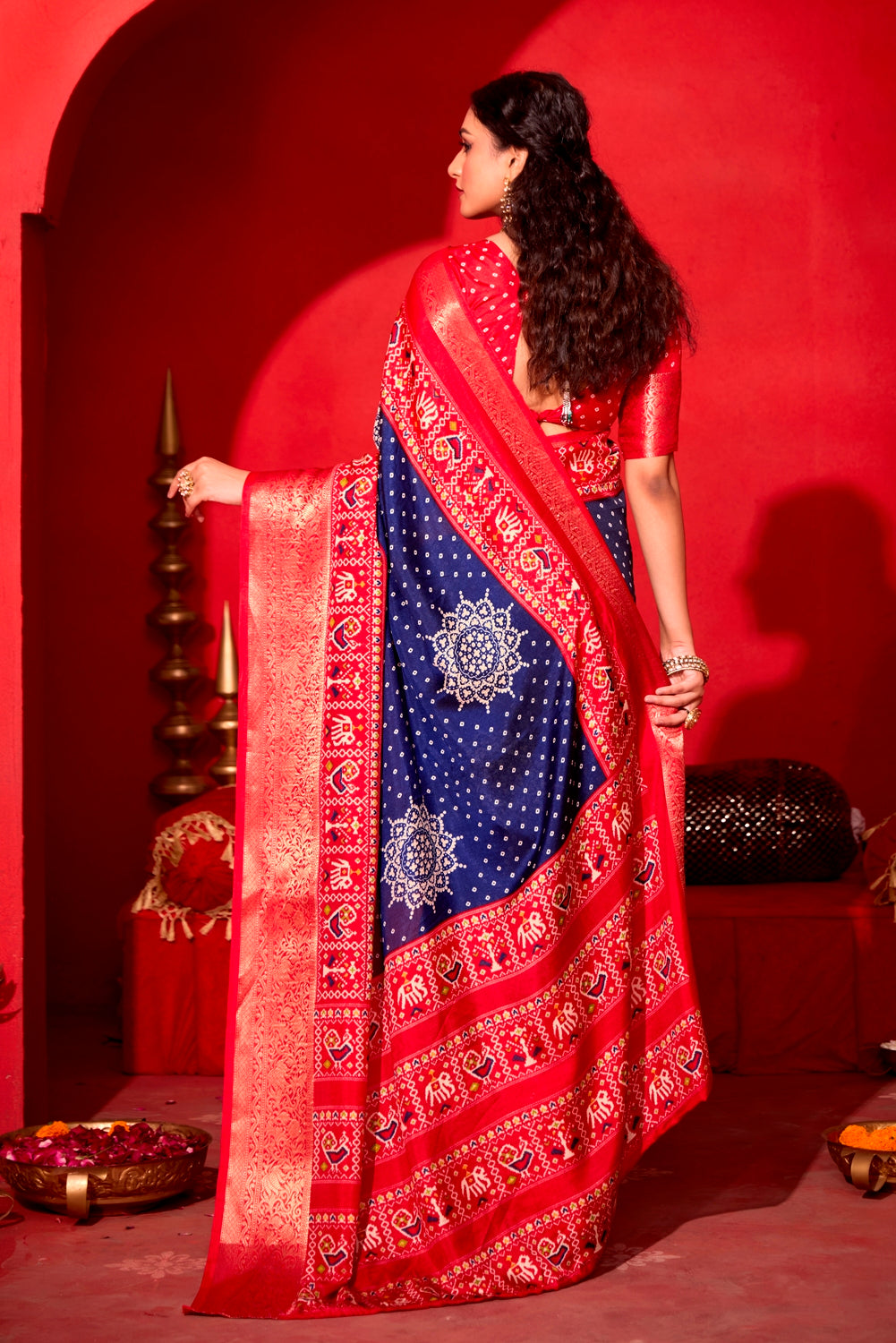 Pure Silk fabric with Royal Blue and Red Dual color Combination of Exclusive Bandhej print with Rich Look Jacquard Border Exclusive Look Saree