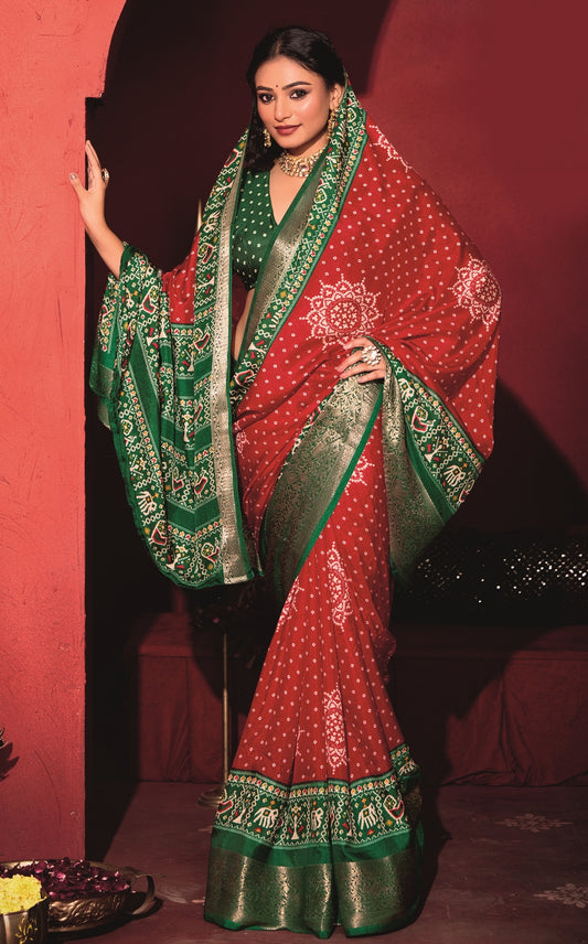 Pure Silk fabric with Exclusive Red and Dark Green Dual color Combination of Exclusive Bandhej print with Rich Look Jacquard Border Exclusive Look Saree