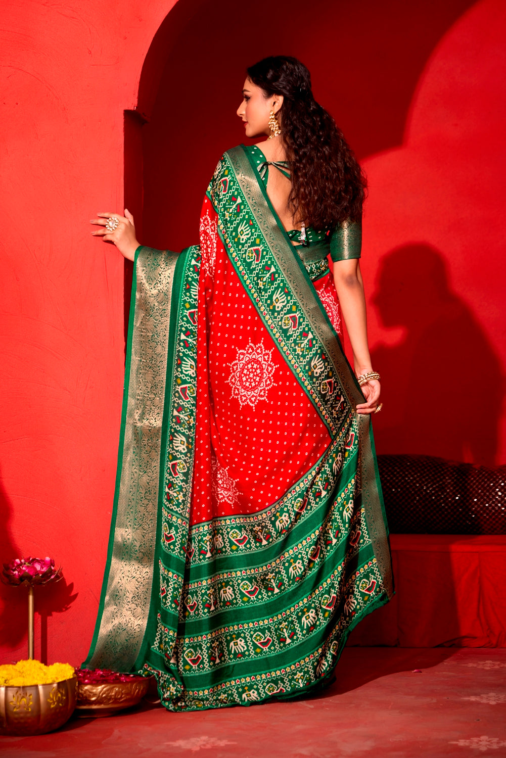 Pure Silk fabric with Exclusive Red and Dark Green Dual color Combination of Exclusive Bandhej print with Rich Look Jacquard Border Exclusive Look Saree