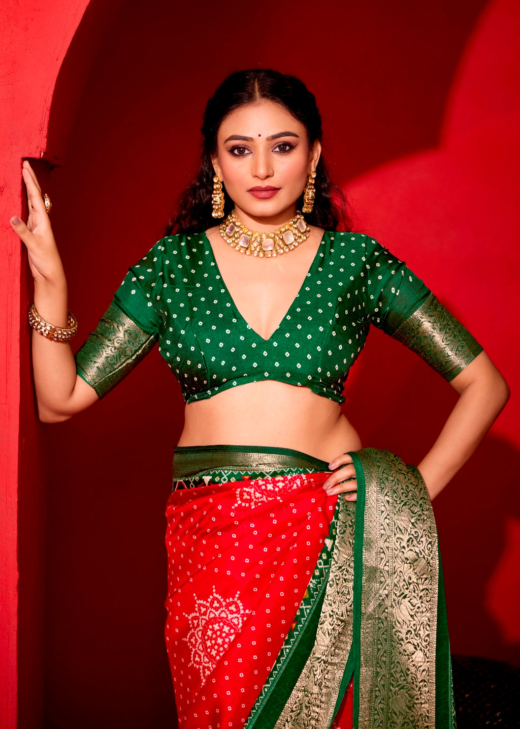 Pure Silk fabric with Exclusive Red and Dark Green Dual color Combination of Exclusive Bandhej print with Rich Look Jacquard Border Exclusive Look Saree