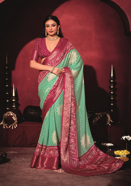 Pure Silk fabric with Exclusive Light Sea Green and Magenta Dual color Combination of Exclusive Bandhej print with Rich Look Jacquard Border Exclusive Look Saree