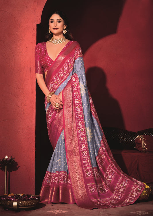 Pure Silk fabric with Exclusive Light Levender and Cherry Red Dual color Combination of Exclusive Bandhej print with Rich Look Jacquard Border Exclusive Look Saree