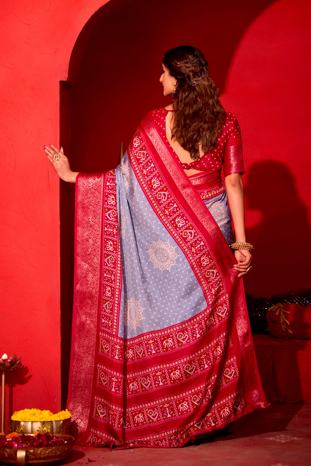 Pure Silk fabric with Exclusive Light Levender and Cherry Red Dual color Combination of Exclusive Bandhej print with Rich Look Jacquard Border Exclusive Look Saree